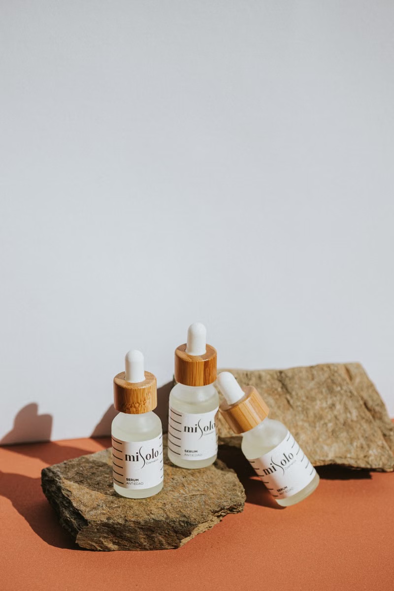 Skincare dropper bottles in a vertical product video frame